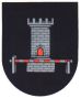 Das Wappen von Bettmar zeigt auf schwarzem Grund einen silbernen Turm mit davor befindlicher Schranke. Turm und Schranke symbolisieren den mittelalterlichen Durchlass durch die Hildesheimer Landwehr, der sich einst in Bettmar befand.
