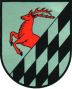 Das Wöhler Wappen besteht aus Teilen des Familienwappens der Familie von Wobersnow und zeigt auf silbernem Grund einen halben steigenden roten Hirsch und ein schwarzes Rautenmuster.